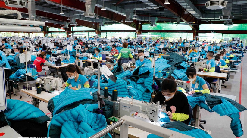 May hàng xuất khẩu sang thị trường Mỹ, EU. (Ảnh: Trần Việt/TTXVN)